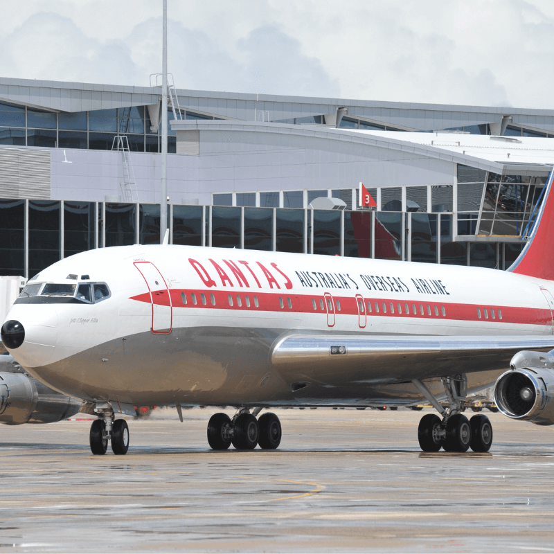 Front end of a 1960s Qantas Boeing 707 sitting on the tarmac